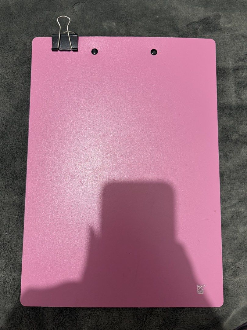 Pink A4 Plastic Clipboard with clip (Category: Stationery & School Supplies) located in Mandaluyong City. Submitted by josa_xox0i8 (Listing ID 1470665650, Image 2). Description: Item: Pink A4-size clipboard with a sturdy metal clip. Condition: Pre-owned, well-maintained, and clean. Perfect for school, office use, nursing notes, or organizing documents. Inclusions: Includes a binder clip as shown in the photos. Reason for selling: Decluttering..