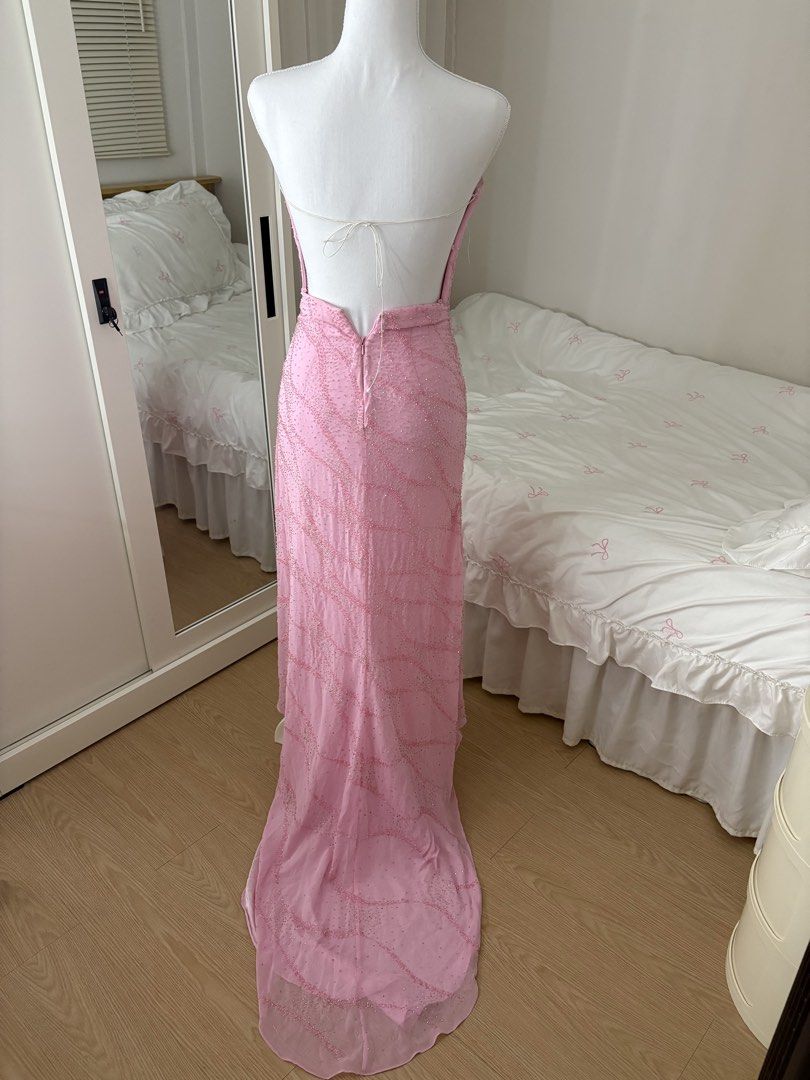 Pink Beaded Strapless Formal Gown with Train (Category: Evening dresses & gowns) located in Binan City. Submitted by andreagailaputen (Listing ID 1470620923, Image 3). Description: - Style: Strapless formal evening dress with a fitted silhouette and small train - Design: Fully covered in pink and silver sequins and beads in an eye-catching wavy pattern - Back Details: Secure back zipper closure with hook-and-eye, plus a stunning adjustable lace-u