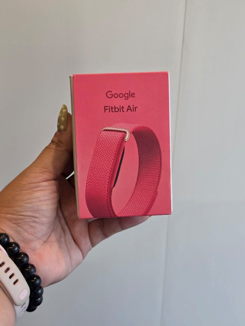 Pink Google Fitbit Air (Category: Wearables & Smart Watches) located in Taguig. Submitted by belle8816 (Listing ID 1470591333, Image 1). Description: brand new won this at a company raffle already using a different wearable location is BGC .