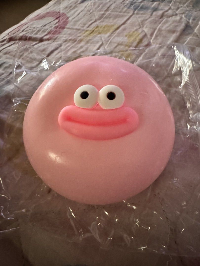 Pink Googly Eye Squishy Face Stress Toy (Category: Kids Toys) located in Manila. Submitted by beadeclutter (Listing ID 1470579714, Image 1). Description: - Color: Pink - Design: Cute googly eyes and wide smiling mouth - Texture: Super stretchy and squishy - Condition: Brand new, sealed in a clear plastic wrapper - Uses: Great desk toy, stress relief, and sensory fidget item.