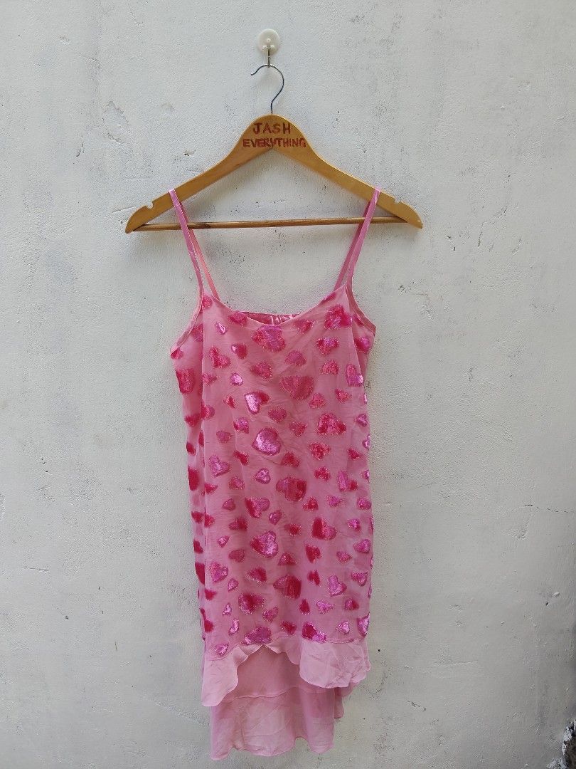 Pink Heart Print Spaghetti Strap Dress (Category: Dresses) located in City of Isabela. Submitted by jasheverything (Listing ID 1470721099, Image 1). Description: - Style: Y2K aesthetic, fun party piece - Design: Bright pink with shiny velvet hearts - Details: Sheer fabric overlay, ruffled high-low hem, scoop neckline - Fit: Adjustable thin spaghetti straps.