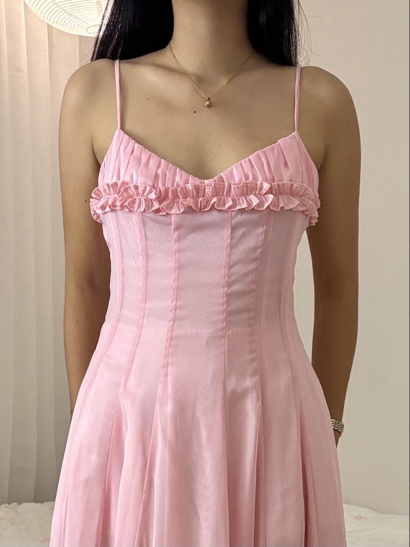 Pink Maxi Dress Spaghetti Strap Ruffle Bodice (Category: Dresses) located in Binan City. Submitted by andreagailaputen (Listing ID 1470629692, Image 3). Description: - Style: Long pink maxi dress with flowy chiffon skirt - Details: Sweetheart neckline, ruffled trim, vertical bodice seaming, spaghetti straps - Material: Lightweight and flowy with great movement - Condition: Worn once for a few hours, clean and like new - Perfect for: Events, parti