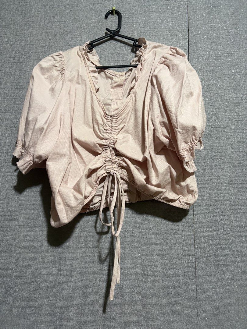 Pink Short Sleeve Cropped Blouse with Drawstring (Category: Blouses) located in Manila. Submitted by wildriver.e8b64e (Listing ID 1470707735, Image 1). Description: - Pink cropped blouse - Short puff sleeves with ruffle neckline - Adjustable front drawstring for ruching - Center back button closure - Textured fabric, ideal for warm weather - Mode of Payment: GCash, BPI - Shipping via J&T or Flash Express.