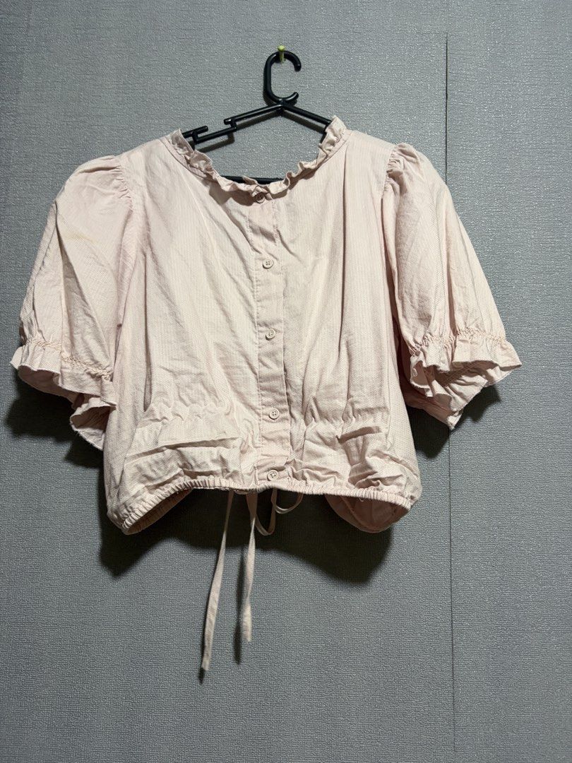 Pink Short Sleeve Cropped Blouse with Drawstring (Category: Blouses) located in Manila. Submitted by wildriver.e8b64e (Listing ID 1470707735, Image 2). Description: - Pink cropped blouse - Short puff sleeves with ruffle neckline - Adjustable front drawstring for ruching - Center back button closure - Textured fabric, ideal for warm weather - Mode of Payment: GCash, BPI - Shipping via J&T or Flash Express.