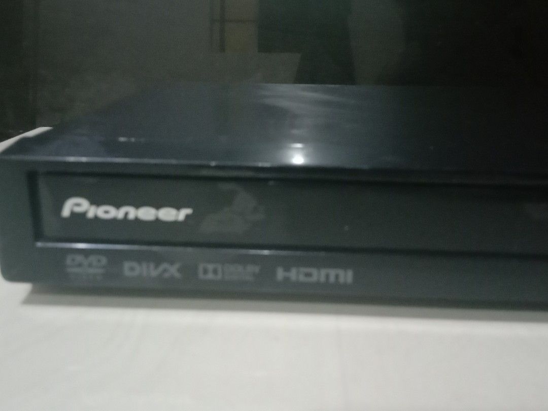 Pioneer DVD Player 110v (Category: Blu-Ray & Media Players) located in Manila. Submitted by redvincent01640 (Listing ID 1470573458, Image 2). Description: - Brand: Pioneer - Color: Sleek black finish - Power: Requires 110V - Media: Plays DVDs with DivX and Dolby Digital support - Connectivity: Includes HDMI output and front USB port - Features: Front panel with disc tray and basic controls - Condition: Solid unit, perfect for home entertainment s