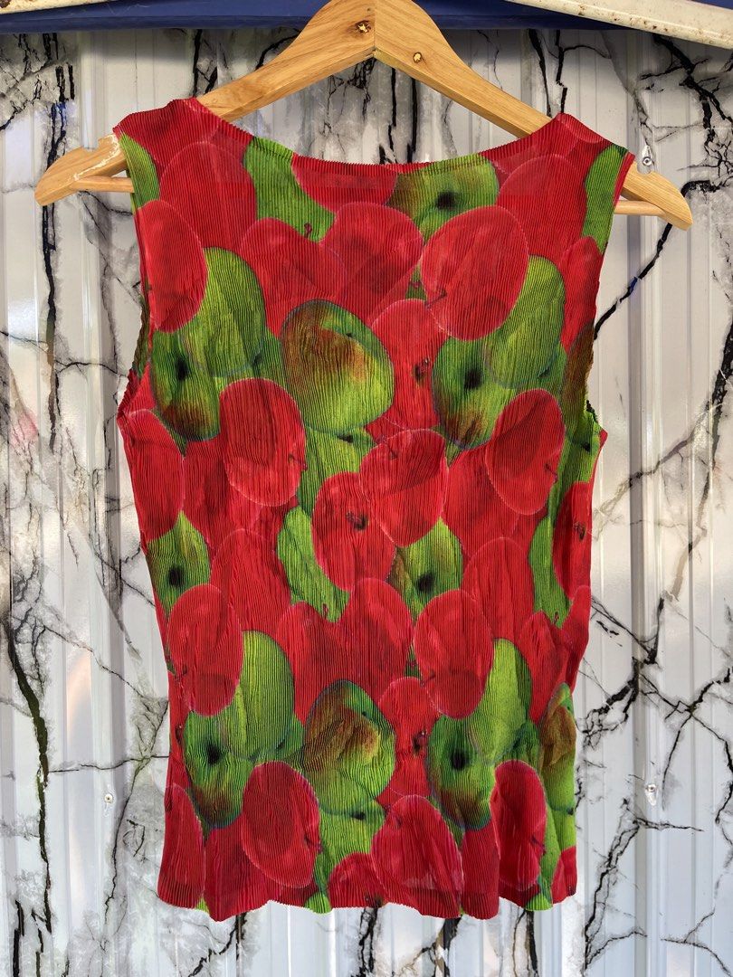 Pleats please authentic (Category: Luxury Apparel) located in Lupon. Submitted by certhrified_legit21 (Listing ID 1470617125, Image 2). Description: This item is a Pleats Please Issey Miyake red and green apple-print sleeveless pleated top (model/part number PP83-FK312).