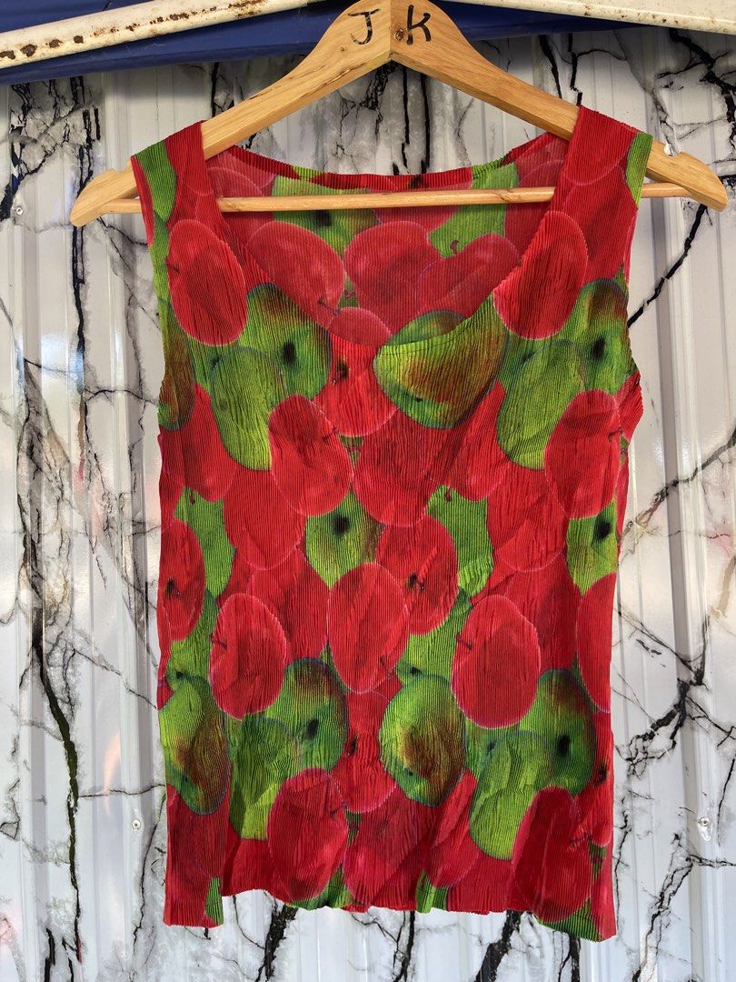 Pleats please authentic (Category: Luxury Apparel) located in Lupon. Submitted by certhrified_legit21 (Listing ID 1470617125, Image 1). Description: This item is a Pleats Please Issey Miyake red and green apple-print sleeveless pleated top (model/part number PP83-FK312).