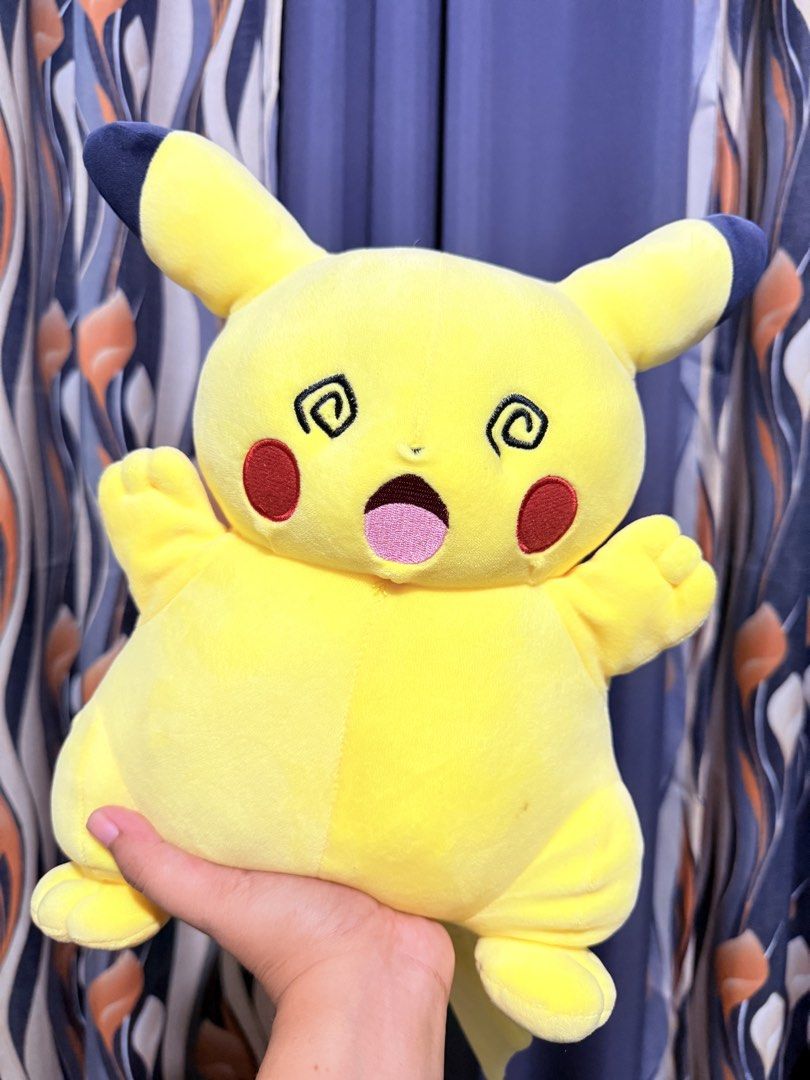Pokemon Pikachu Dizzy Face (Category: Plushies & Soft Toys) located in Cavite. Submitted by projectplushie (Listing ID 1468383225, Image 1). Description: - Super soft and squishy round Pikachu plush - Features a funny dizzy eyes and open mouth expression - Bright yellow body with iconic brown tail stripes - Perfect addition to any Pokemon plush collection - WITH FLAWS (DISCOLORED BACK).