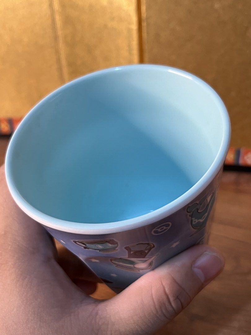 Pokémon Blue Melamine Cup Mug (Category: Coffee & Tea Tableware) located in Gapan. Submitted by lunashop14 (Listing ID 1470633837, Image 3). Description: - Official Nintendo merchandise from the Pokémon Blue collection - Features wrap-around illustrations of Lucario, Vaporeon, Quaxly, Glaceon, Lapras, Omanyte, and Polteageist - Made of durable blue melamine with a pale blue interior - Standard tumbler shape with stylish faceted sides - Official s