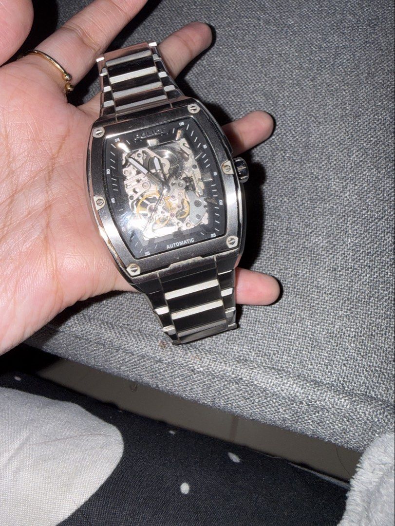 Police Automatic Skeleton Stainless Steel Wristwatch (Category: Men's Watches) located in Manila. Submitted by rare.desteen (Listing ID 1470563699, Image 2). Description: - Brand: Police Automatic Skeleton Wristwatch - Case: Tonneau-shaped silver-tone stainless steel - Dial: Black inner dial with visible intricate mechanical movement - Strap: Matching stainless steel link bracelet with folding clasp - Movement: Automatic self-winding (visible fro