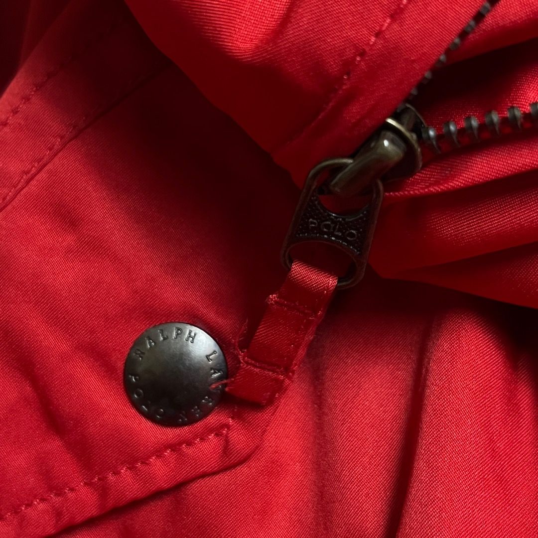 Polo Ralph Lauren Red Zip Aviator Jacket (Category: Coats, Jackets and Outerwear) located in Caloocan City. Submitted by achilles_grails (Listing ID 1470727284, Image 3). Description: - Brand: Polo Ralph Lauren - Color: Bright red with embroidered black pony logo - Size: XL - Design: Classic high collar with full front zipper and button details on pockets and collar tab - Lining: Dark fleece lining for extra warmth - Material: Durable polyester f