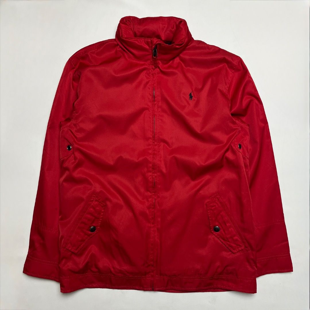 Polo Ralph Lauren Red Zip Aviator Jacket (Category: Coats, Jackets and Outerwear) located in Caloocan City. Submitted by achilles_grails (Listing ID 1470727284, Image 1). Description: - Brand: Polo Ralph Lauren - Color: Bright red with embroidered black pony logo - Size: XL - Design: Classic high collar with full front zipper and button details on pockets and collar tab - Lining: Dark fleece lining for extra warmth - Material: Durable polyester f