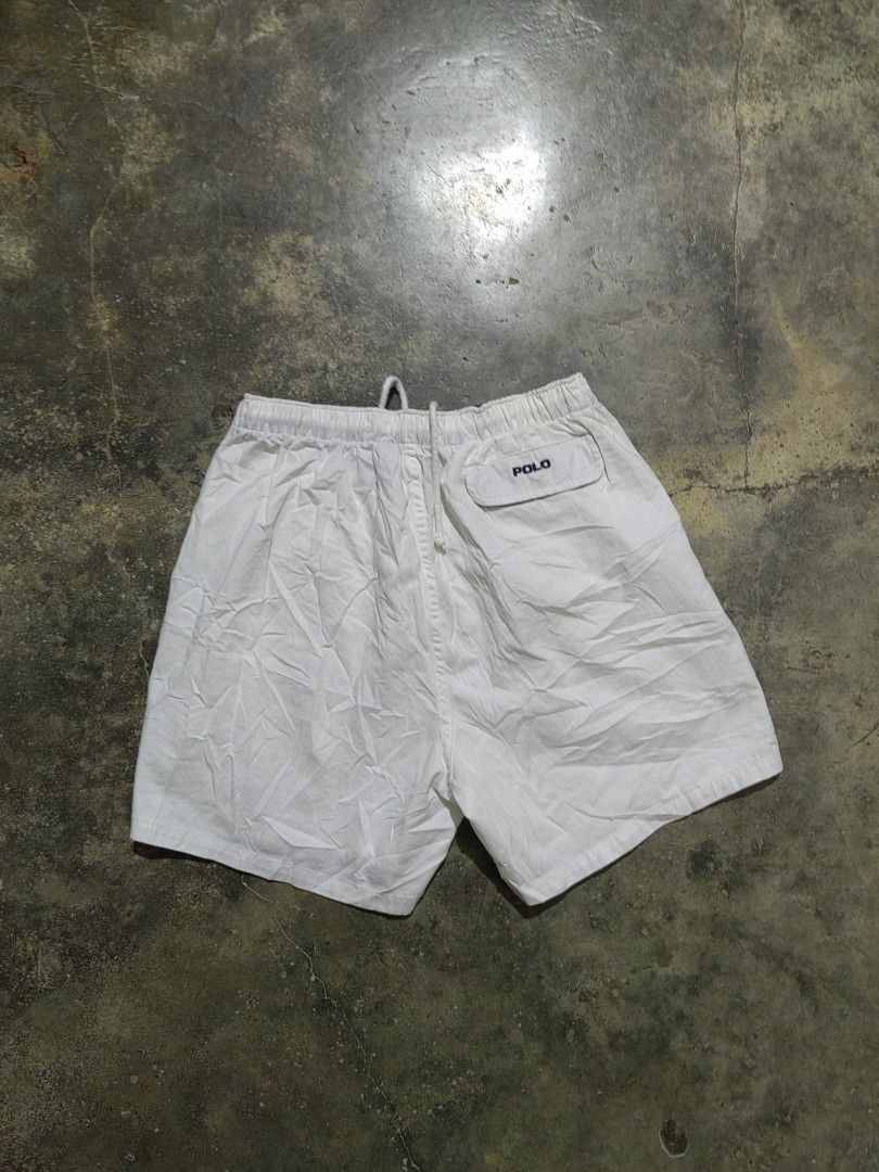 Polo Ralph Lauren White Drawstring Shorts (Category: Shorts) located in Matnog. Submitted by erasmoarnold.b9c007 (Listing ID 1470634744, Image 2). Description: - Brand: Polo Ralph Lauren - Color: Classic White - Material: Lightweight, breathable cotton (ideal for warm weather) - Fit/Adjustability: Elastic waistband with adjustable drawstring - Branding: Small embroidered pony logo near the left hem - Details: Back pocket with flap closure and POL