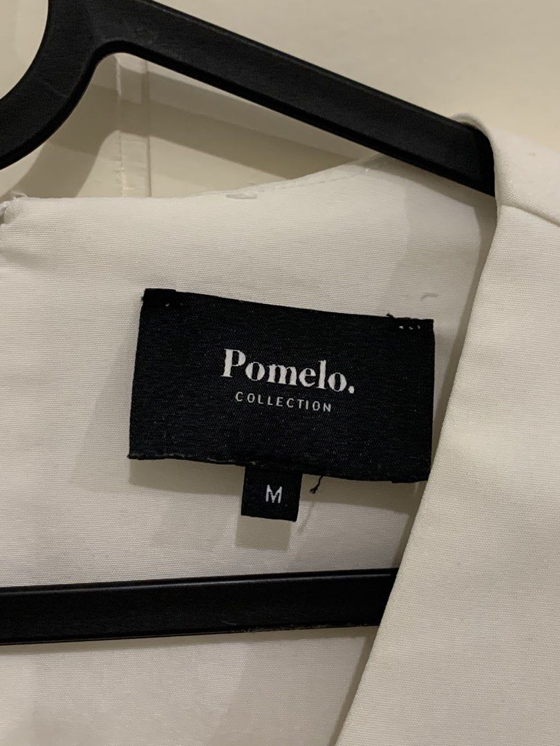 Pomelo Collection White Dress Size M (Category: Dresses) located in Pasig City. Submitted by lovedbyri (Listing ID 1470631611, Image 3). Description: - Brand: Pomelo Collection - Size: M (Tag attached) - Color: Solid White - Style: Mini dress with flared A-line skirt silhouette - Details: Short puffed sleeves with cuffed hems, V-neckline, decorative metal-trimmed front buttons - Closure: Back zip closure .