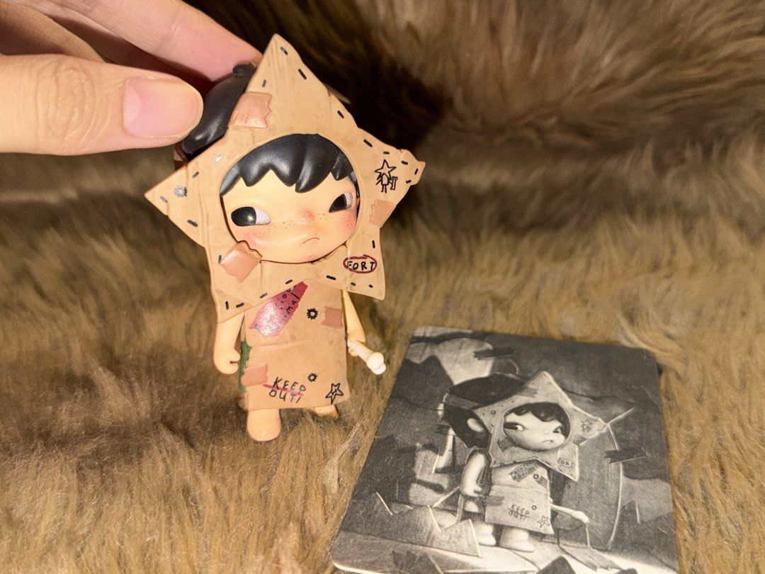Pop Mart Hirono Shelter Warrior Figure (Category: Designer & Blind Box Toys) located in Mandaluyong City. Submitted by knb.ph (Listing ID 1470670253, Image 3). Description: - Pop Mart Hirono Shelter Series - Warrior - Figure with cardboard star costume, small bone accessory, and character card - Sturdy vinyl material with detailed paintwork including 'Stay Alert' and 'Keep Out' markings - Brand new / opened to check design only.