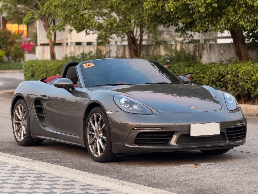 Porsche 718 Boxster Auto (Category: Used Cars) located in Manila. Submitted by quality_cars (Listing ID 1470629471, Image 2). Description: Fresh In‼️ Elegance in every detail. Performance without compromise. 💯 For Sale | Trade-In | Financing Accepted 2024 Porsche Boxster 718 Automatic Transmission Mileage: 5k+ Original Mileage Ending Plate: Friday Coding Color: Gray Engine: 2.0L Turbocharged Flat 4-Boxer Fuel Type: Gasoline Upgrades & Features: 