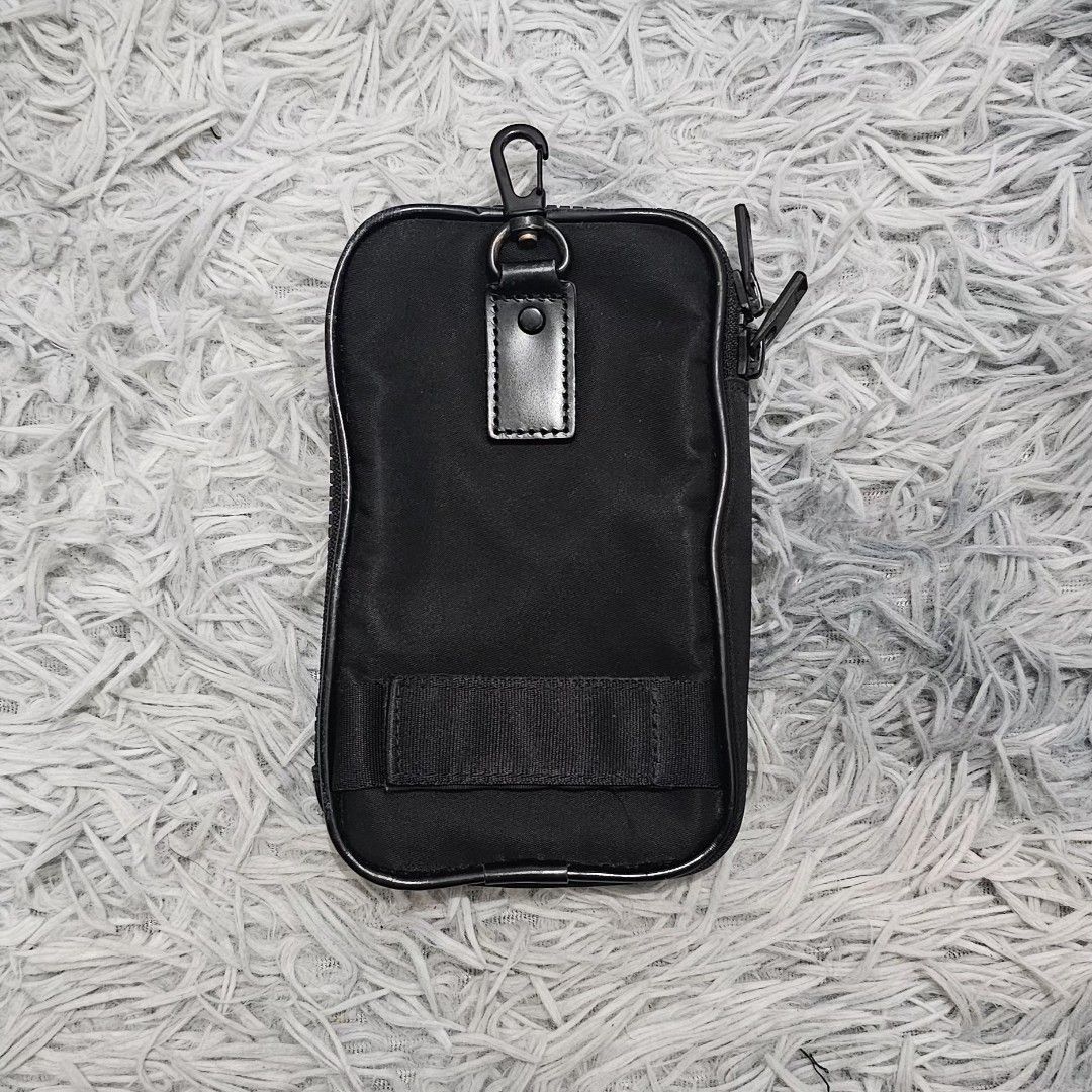 PORTER Yoshida & Co. Cellphone Case Pouch (Category: Belt bags, Clutches and Pouches) located in Manila. Submitted by shio_gray (Listing ID 1470698136, Image 3). Description: Authentic H 6.5 x W 4 x D 1 inches.