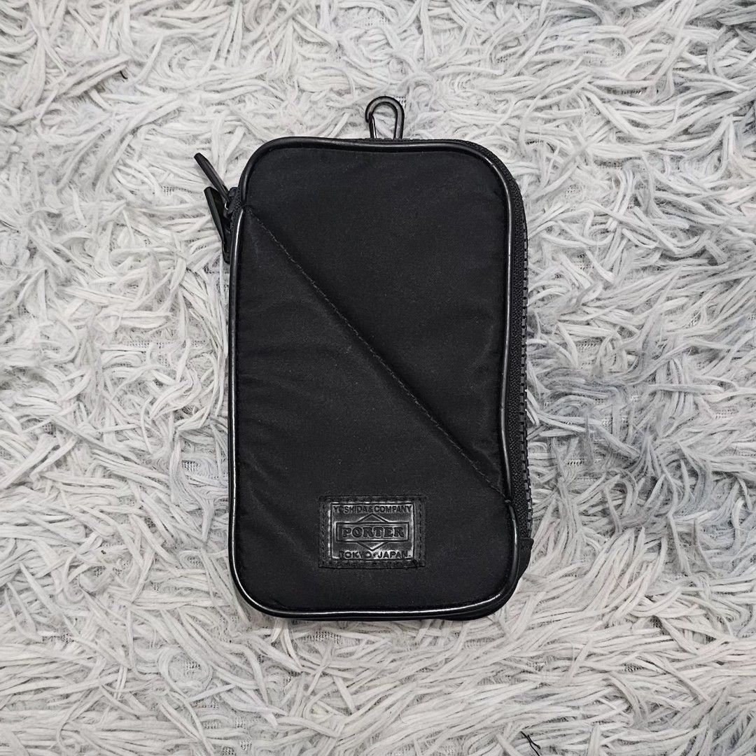 PORTER Yoshida & Co. Cellphone Case Pouch (Category: Belt bags, Clutches and Pouches) located in Manila. Submitted by shio_gray (Listing ID 1470698136, Image 2). Description: Authentic H 6.5 x W 4 x D 1 inches.