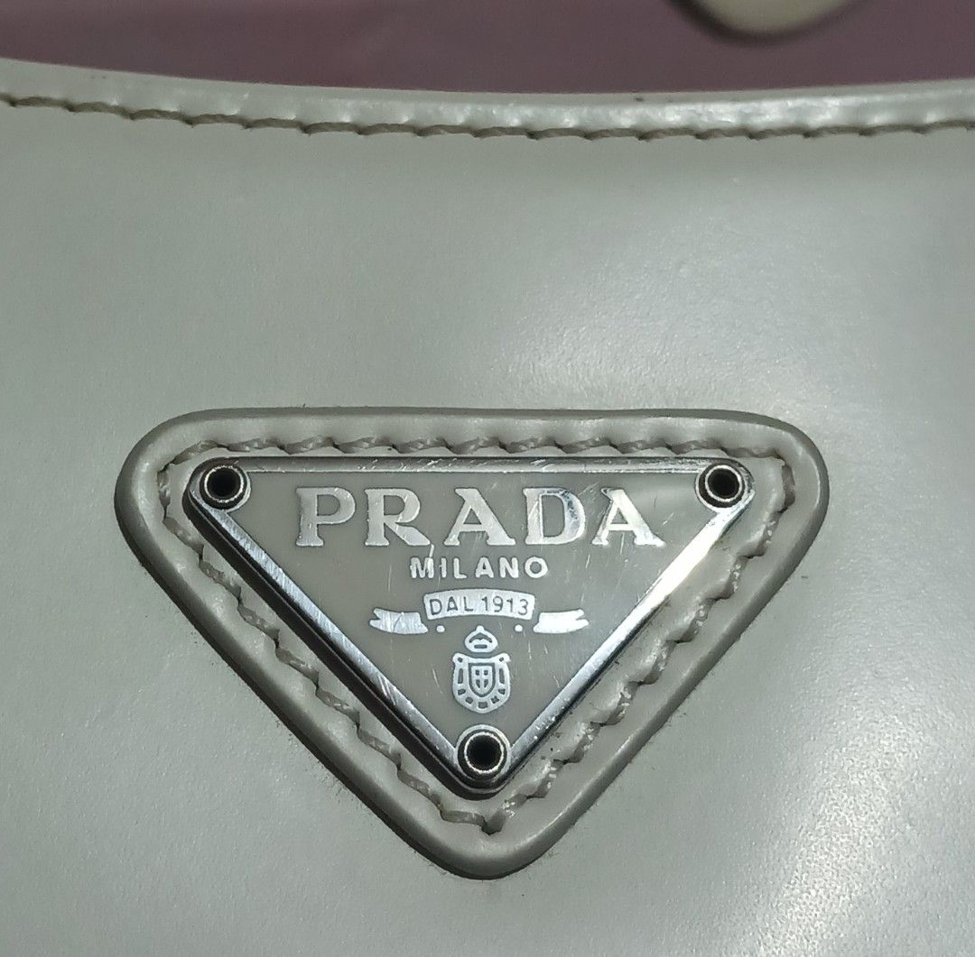 Prada Cleo Shoulder Bag (Category: Luxury Bags & Wallets) located in Roxas City. Submitted by tabot (Listing ID 1470723077, Image 2). Description: - Ukay2x source - Secure magnetic snap closure - With inner open pocket - Condition: 1. Gentle signs of wear on the leather surface. 2. Clean inside 3. Intact rubber linings 4. No tear, no cracks.