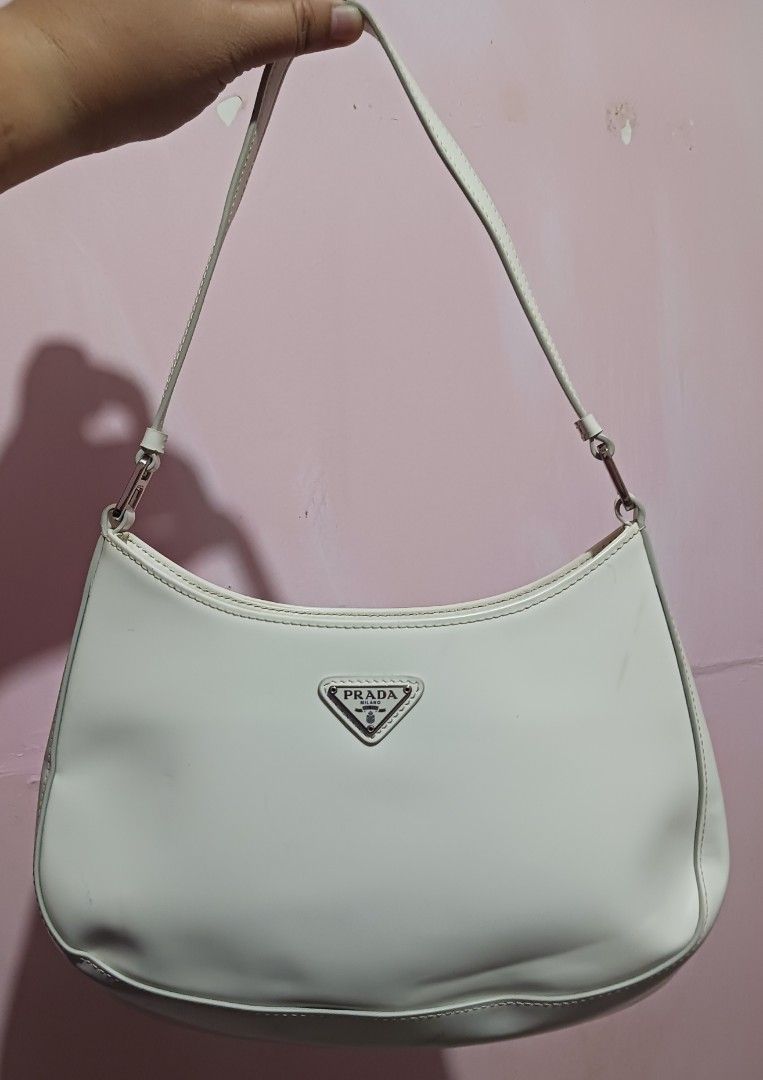 Prada Cleo Shoulder Bag (Category: Luxury Bags & Wallets) located in Roxas City. Submitted by tabot (Listing ID 1470723077, Image 1). Description: - Ukay2x source - Secure magnetic snap closure - With inner open pocket - Condition: 1. Gentle signs of wear on the leather surface. 2. Clean inside 3. Intact rubber linings 4. No tear, no cracks.