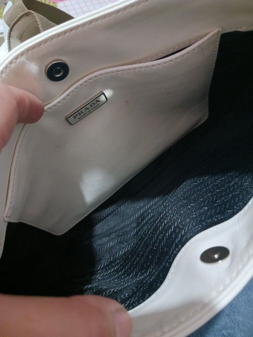 Prada Cleo Shoulder Bag (Category: Luxury Bags & Wallets) located in Roxas City. Submitted by tabot (Listing ID 1470723077, Image 3). Description: - Ukay2x source - Secure magnetic snap closure - With inner open pocket - Condition: 1. Gentle signs of wear on the leather surface. 2. Clean inside 3. Intact rubber linings 4. No tear, no cracks.