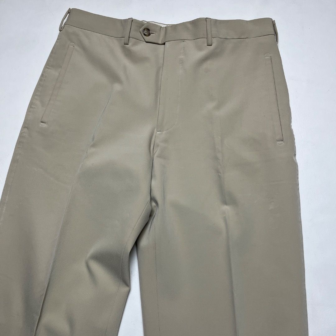 Prada Men's Beige Tailored Trousers Size 46 (Category: Trousers) located in Caloocan City. Submitted by achilles_grails (Listing ID 1470565503, Image 2). Description: - Brand: Prada - Color: Classic Beige - Size: 46 (Italian Sizing) - Fit: Straight leg - Origin: Made in Italy - Details: Clean vertical front pockets, crisp center creases, and internal branding labels intact - Style: Versatile for business meetings or smart casual looks.