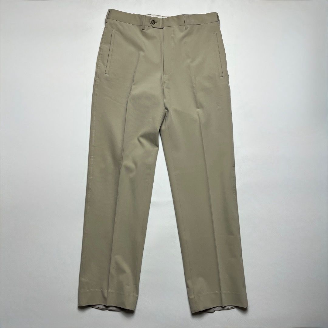 Prada Men's Beige Tailored Trousers Size 46 (Category: Trousers) located in Caloocan City. Submitted by achilles_grails (Listing ID 1470565503, Image 1). Description: - Brand: Prada - Color: Classic Beige - Size: 46 (Italian Sizing) - Fit: Straight leg - Origin: Made in Italy - Details: Clean vertical front pockets, crisp center creases, and internal branding labels intact - Style: Versatile for business meetings or smart casual looks.