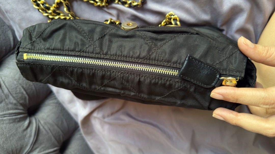 Prada Quilted Nylon Chain Shoulder Bag Black B2811 (Category: Luxury Bags & Wallets) located in Manila. Submitted by ac32370 (Listing ID 1470603802, Image 3). Description: - Brand: Prada - Model: B2811 (Nero) - Material: Black quilted nylon - Hardware: Gold-tone chain strap interwoven with leather - Details: Iconic triangle logo plaque on front flap, fabric-lined interior with zip pocket - Inclusions: Authentication cards and envelopes as picture