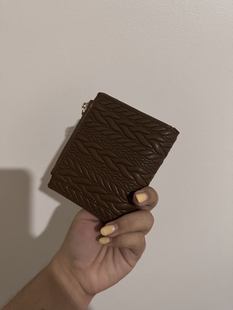 Preloved Charles & Keith Brown Wallet (Category: Wallets & Card holders) located in Bacoor. Submitted by alliabuysandsells (Listing ID 1470708611, Image 3). Description: charles & keith preloved wallet (not sure if it’s authentic bought it here on carousell) brown braided pattern no issues comes with box.