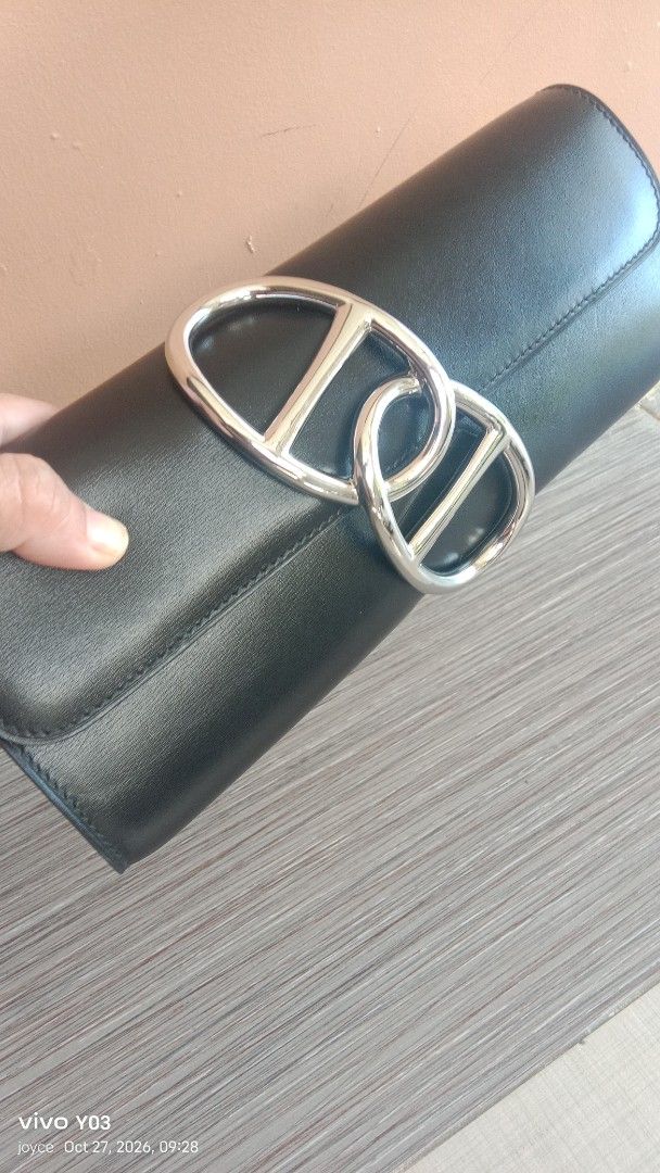 Preloved Hermes Black Leather Clutch (Category: Luxury Bags & Wallets) located in Cabuyao City. Submitted by selections888 (Listing ID 1470587283, Image 2). Description: - prelovedHermes black leather clutch bag -from Japan supplier - Elegant structured shape with smooth leather body - Silver-tone front hardware closure with Hermes Paris engraving - Interior stamped with Hermes Paris Made in France - Classic evening bag style perfect for special 