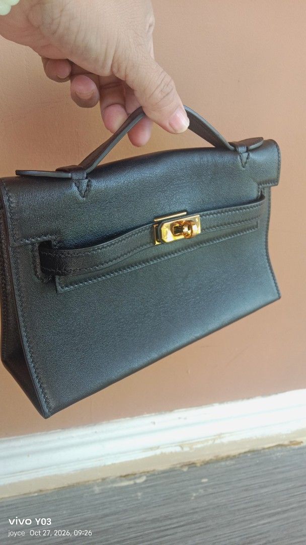Preloved Hermes Black Leather Top Handle Handbag Gold Hardware (Category: Luxury Bags & Wallets) located in Cabuyao City. Submitted by selections888 (Listing ID 1470588348, Image 1). Description: - preloved from Japan supplier - Premium black leather material - Elegant top handle with secure gold clasp closure - Structured shape with expandable gusseted sides - Neat, clean stitching along the front flap and straps - Compact and practical size for