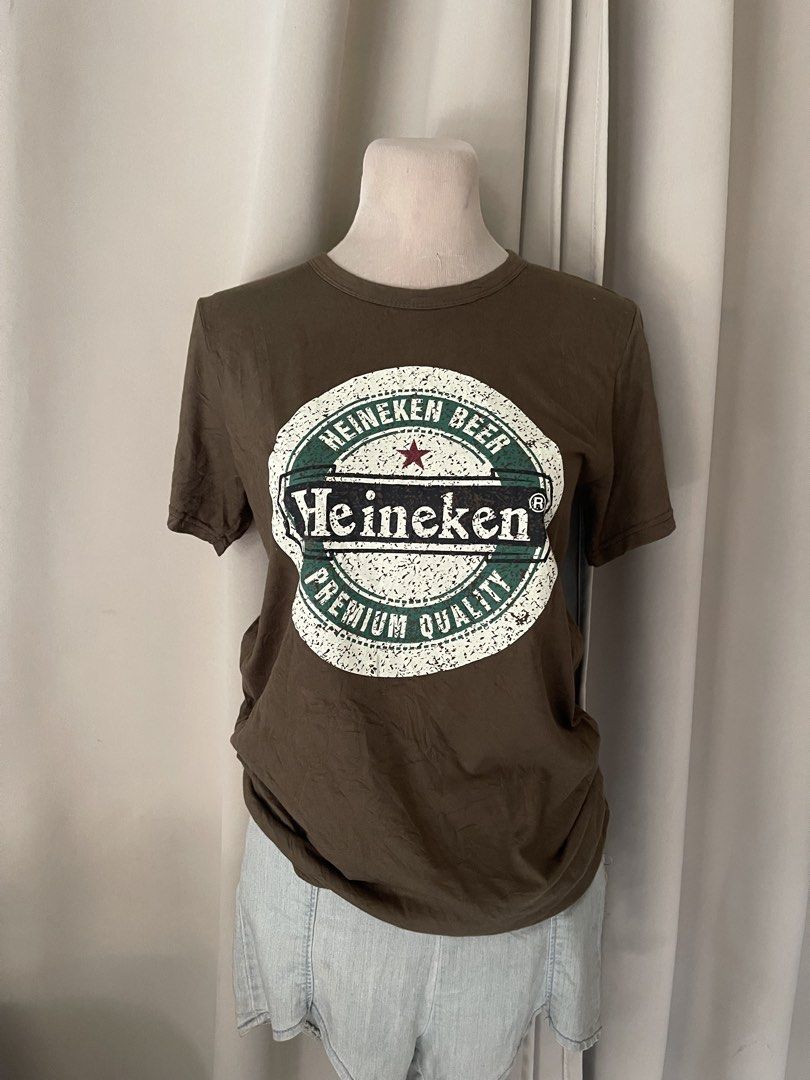 premium Beer army Graphic Tee (Category: Shirts) located in Cainta. Submitted by zlove111 (Listing ID 1470707820, Image 1). Description: army color short-sleeve t-shirt with large Heineken beer graphic printed on the front. Classic crew neckline. Soft cotton fabric. Easy to style with denim jeans or shorts for casual everyday wear. small-semi large premium cotton.