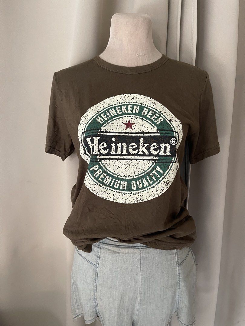 premium Beer army Graphic Tee (Category: Shirts) located in Cainta. Submitted by zlove111 (Listing ID 1470707820, Image 2). Description: army color short-sleeve t-shirt with large Heineken beer graphic printed on the front. Classic crew neckline. Soft cotton fabric. Easy to style with denim jeans or shorts for casual everyday wear. small-semi large premium cotton.