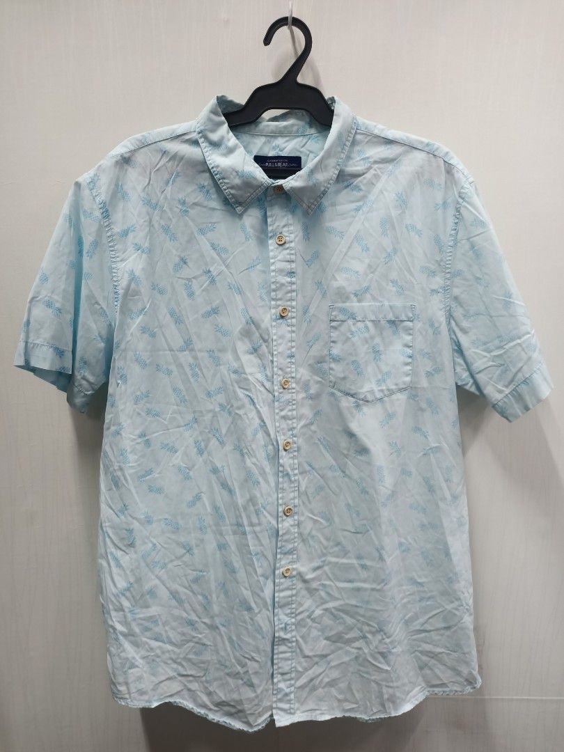 Pull&Bear Light Blue Pineapple Print Short Sleeve Shirt XL (Category: Tshirts & Polo Shirts ) located in Bayombong. Submitted by rheaaa00530 (Listing ID 1470672712, Image 1). Description: - Brand: Pull&Bear - Style: Short-sleeve button-up shirt with classic collar and left chest pocket - Color/Design: Light blue with all-over pineapple print - Size: EUR/XL / MEX/42 - Fit: Regular fit - Condition: Great casual piece for warm weather.