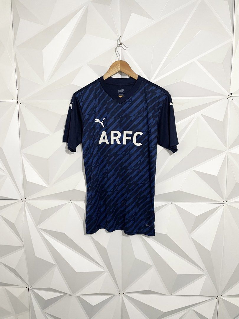 Puma ARFC Blue Soccer Jersey (Category: Activewear) located in Cabuyao City. Submitted by ParadisethriftedPh (Listing ID 1470730481, Image 1). Description: Cr: 9.8/10 Dimensions W: 19 L: 27 - Brand: Puma - Color: Navy blue with diagonal pattern and white accents - Size: Medium (Made in Vietnam) - Features: dryCELL technology, ARFC chest lettering, Puma logos on front and shoulders, and large red number 32 print on the back - Condition: Clean over