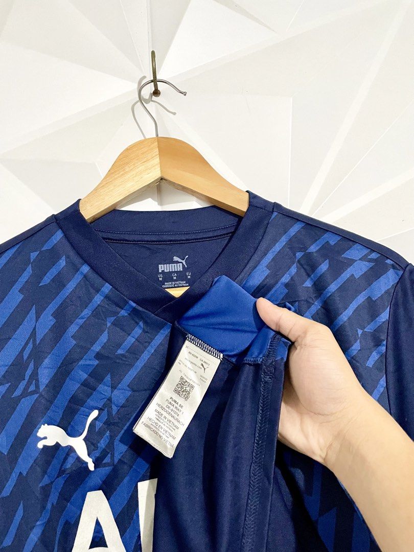 Puma ARFC Blue Soccer Jersey (Category: Activewear) located in Cabuyao City. Submitted by ParadisethriftedPh (Listing ID 1470730481, Image 3). Description: Cr: 9.8/10 Dimensions W: 19 L: 27 - Brand: Puma - Color: Navy blue with diagonal pattern and white accents - Size: Medium (Made in Vietnam) - Features: dryCELL technology, ARFC chest lettering, Puma logos on front and shoulders, and large red number 32 print on the back - Condition: Clean over
