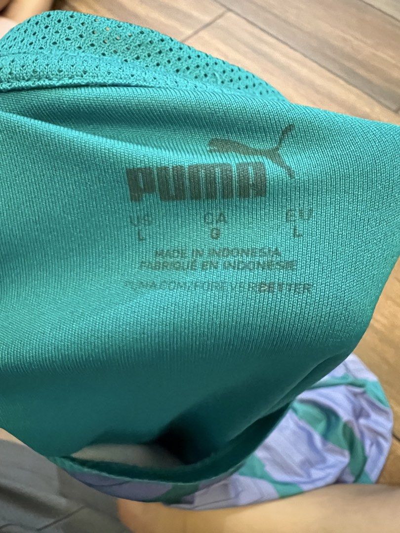 Puma DryCell Athletic Training T-Shirt (Category: Activewear) located in Mandaluyong City. Submitted by johngil101 (Listing ID 1470663134, Image 2). Description: - Brand: Puma - Style: Athletic training top with chevron pattern - Color: Purple and teal with white accents - Size: Large 22x25.