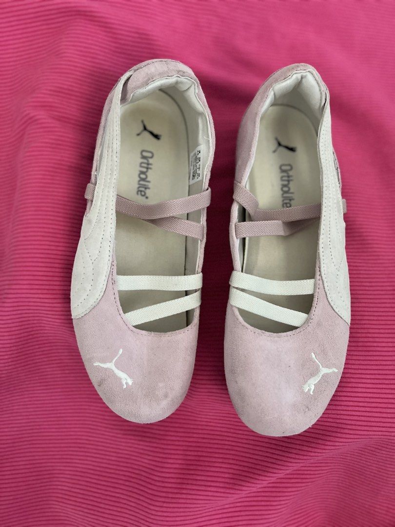 Puma pink ballet flats sneakers (Category: Flats & Sandals) located in Manila. Submitted by zellie11 (Listing ID 1470560863, Image 1). Description: - Color & Style: Pink with white accents, strappy crossover design, and iconic Puma cat logo on the toe and heel - Comfort: Ortholite insoles for extra cushioning and a convenient slip-on style - Durability: Rubber soles with good grip and tread - Condition: Pre-loved with slight scuffs near the front
