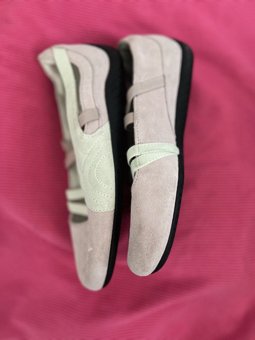 Puma pink ballet flats sneakers (Category: Flats & Sandals) located in Manila. Submitted by zellie11 (Listing ID 1470560863, Image 3). Description: - Color & Style: Pink with white accents, strappy crossover design, and iconic Puma cat logo on the toe and heel - Comfort: Ortholite insoles for extra cushioning and a convenient slip-on style - Durability: Rubber soles with good grip and tread - Condition: Pre-loved with slight scuffs near the front
