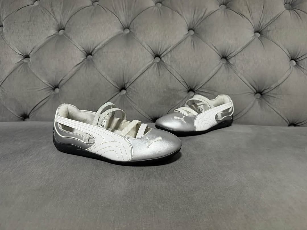 Puma Silver and White Ballet Sneaker Flats (Category: Sneakers) located in Calamba. Submitted by saiphsavion (Listing ID 1470627828, Image 1). Description: - Brand/Model: Puma Sneakers (Ballet Flat Design) - Color: Silver and White with metallic finish - Closure: Dual elastic straps across the top - Details: Stylish side cutouts and Puma cat logo on toe and side - Sole: Flat black rubber sole for comfort - Condition: Excellent / Ready to wear.
