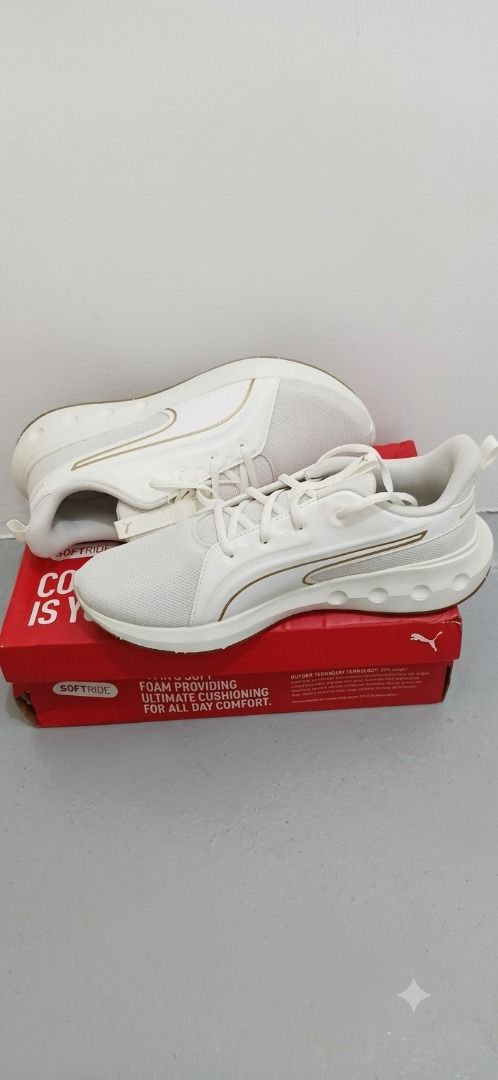 Puma Softride White Gold Sneakers With Box (Category: Sneakers) located in Makati City. Submitted by dikoakalain22 (Listing ID 1470655165, Image 1). Description: - Brand: Puma - Color: White with stylish gold detailing - Comfort: Softride foam cushioning for all-day wear - Closure: Lace-up style with matching white laces - Condition: Brand new, unworn, still in box - Inclusions: Comes with original red and white Puma shoebox.