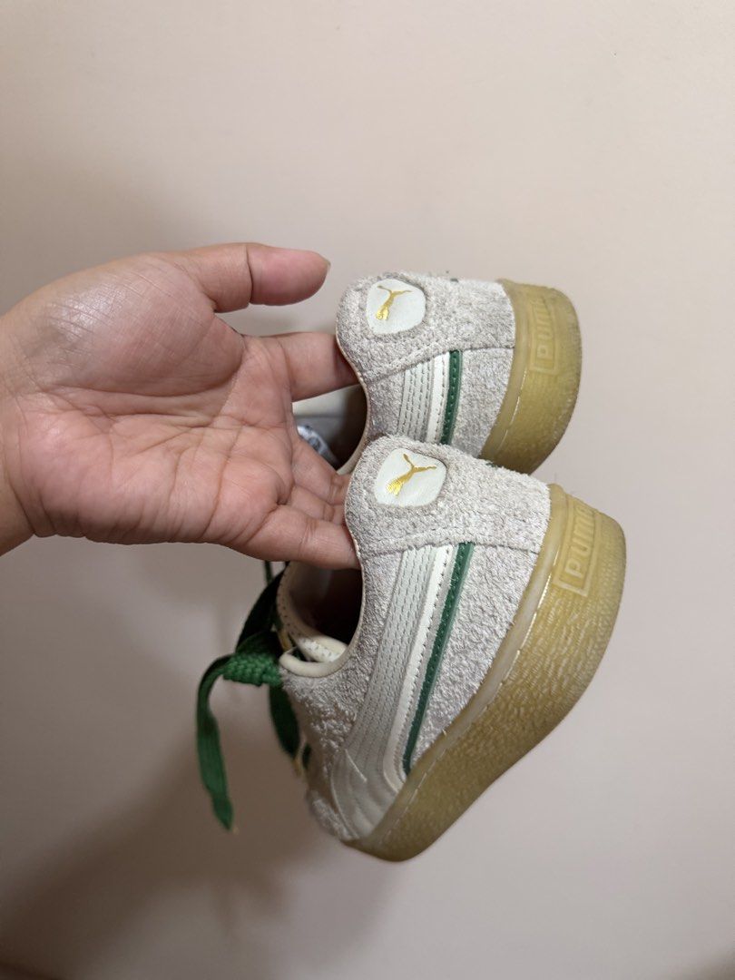 Puma Suede White and Green Sneakers (Category: Sneakers) located in Cebu City. Submitted by maeannxoxo (Listing ID 1470669856, Image 3). Description: - Brand: Puma Suede - Color: Off-white with thick green laces and gold aglets - Details: Gold Puma branding on the side and heel, classic gum sole, and cork insoles - Condition: Worn a few times, uppers and soles still holding up very well - Fit: Great casual pair for everyday rotation.