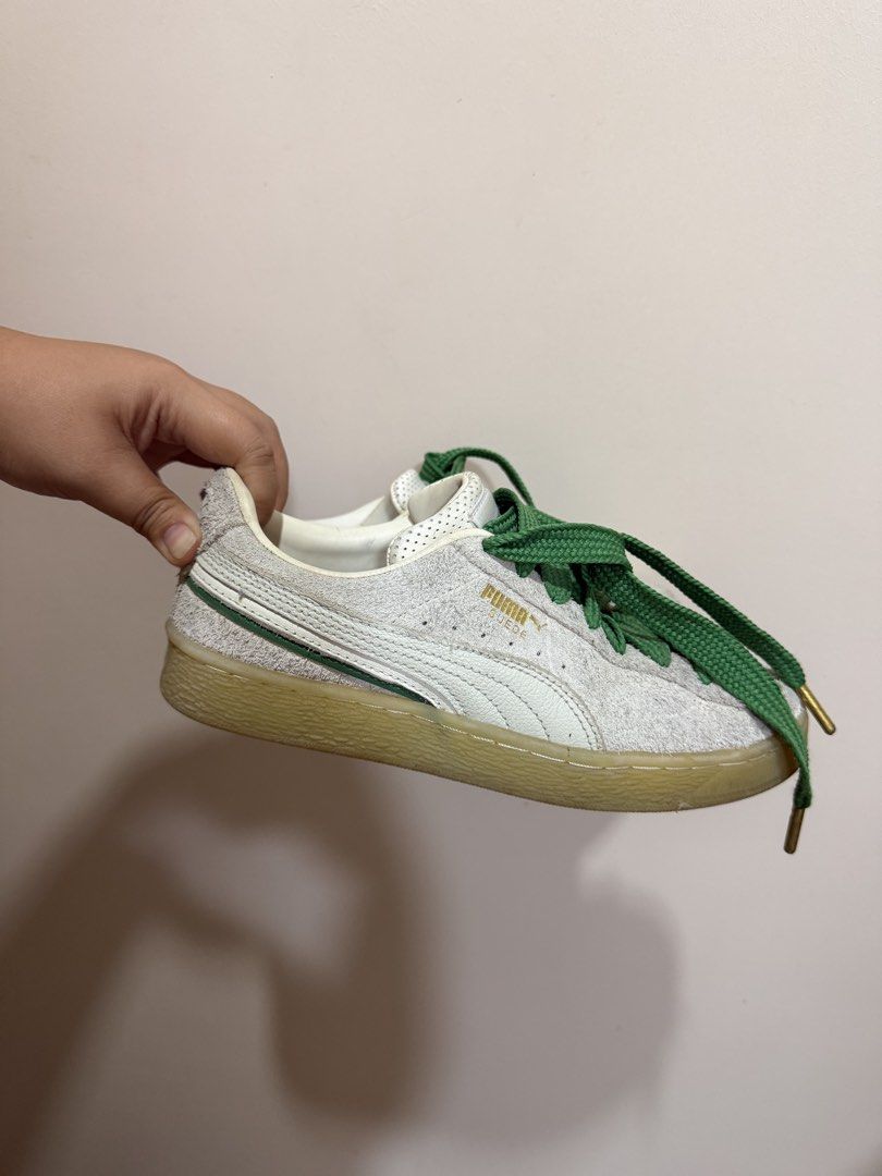Puma Suede White and Green Sneakers (Category: Sneakers) located in Cebu City. Submitted by maeannxoxo (Listing ID 1470669856, Image 1). Description: - Brand: Puma Suede - Color: Off-white with thick green laces and gold aglets - Details: Gold Puma branding on the side and heel, classic gum sole, and cork insoles - Condition: Worn a few times, uppers and soles still holding up very well - Fit: Great casual pair for everyday rotation.