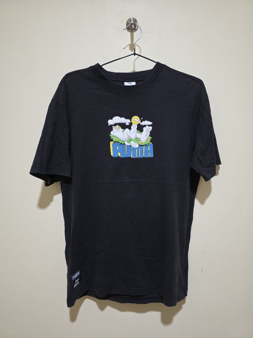 Puma x RIPNDIP Graphic T-Shirt (Category: Tshirts & Polo Shirts ) located in Cebu City. Submitted by epicocean_d0dd19 (Listing ID 1470592232, Image 1). Description: - Brand: Puma x Ripndip Collaboration - Color: Black - Size: Small (S tag at the collar) - Details: Puma logo tag near the hem, ribbed crewneck neckline - Condition: Pre-loved - Mode of Payment: GCash or Bank Transfer - Shipping: Via J&T Express (Buyer shoulders shipping fee).