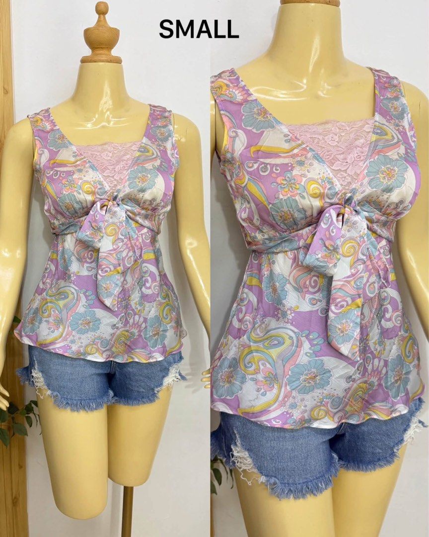 Purple Floral Print Tie-Front Blouse Small (Category: Blouses) located in Tagum. Submitted by bernardino49694 (Listing ID 1470587451, Image 1). Description: - Size: Small - Design: Purple & multi-color floral print - Details: Square neckline with pink lace panel & front tie knot below bust - Fit: Lightweight and flowing - Styling: Perfect with denim shorts - Condition: Brand new / Excellent (ready to ship!).