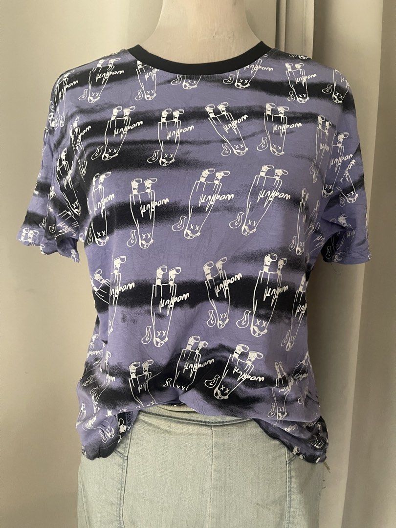 Purple Graphic Print Ringertee (Category: Shirts) located in Cainta. Submitted by zlove111 (Listing ID 1470738506, Image 2). Description: - Style: Streetwear casual short sleeve t-shirt - Design: Purple base with black horizontal stripes and all-over white cartoon character print - Details: Black contrast ringer crewneck collar - Material: Soft, comfortable cotton - Fit: Standard casual fit small/semi large - Versatility: Easy to style with denim
