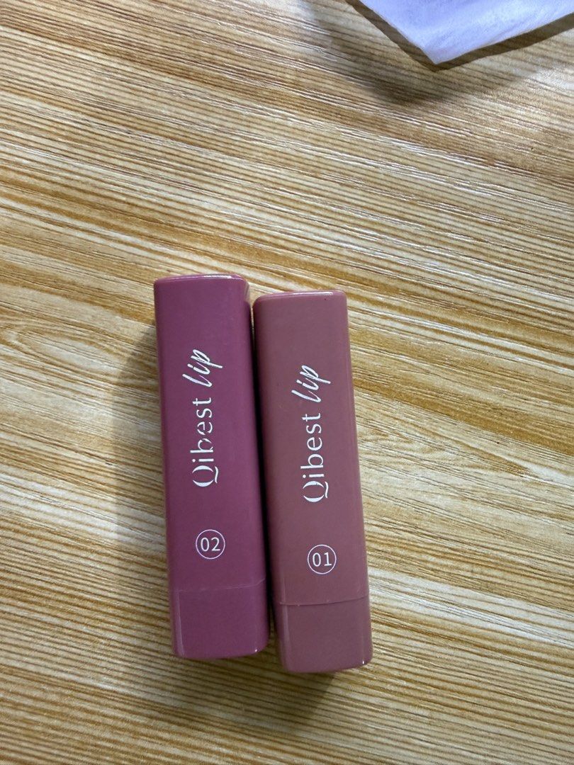 Qibest Lip 01 and 02 Lipstick Set (Category: Makeup) located in Cavite. Submitted by galoreforsale (Listing ID 1470673496, Image 1). Description: - Brand: Qibest - Shades: 01 (Neutral Nude Brown) & 02 (Berry Mauve) - Finish: Creamy matte - Condition: Swatched once, basically untouched, clean tubes with tight caps - Great bundle deal for daily wear or custom mixing.