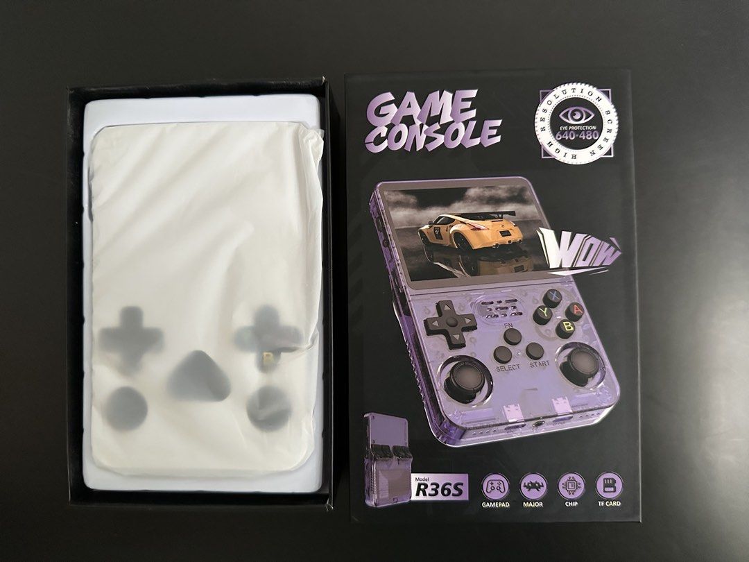 R36S Game Console (128GB) (Category: Other Gadgets) located in Batangas. Submitted by batang90s_ako (Listing ID 1470606729, Image 1). Description: R36S Game Console - Original / Authentic - DarkOS RE - 2 Ram chips - color transparent purple - 128 GB sd card - 20,000 retro games included - Opened for testing purposes only and returned to its original box. RFS: need funds .