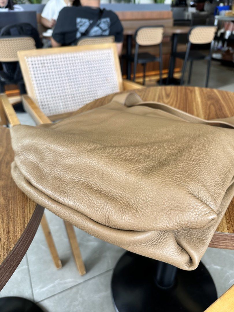 Rabeanco JHU Bag (Category: Shoulder Bags) located in Baguio. Submitted by judyannlacaden (Listing ID 1470607078, Image 3). Description: - Color: Versatile taupe that goes with everything - Material: Soft, pebble-grained leather - Design: Comfortable wide shoulder strap with a simple open-top closure - Capacity: Spacious interior with plenty of room for daily essentials.