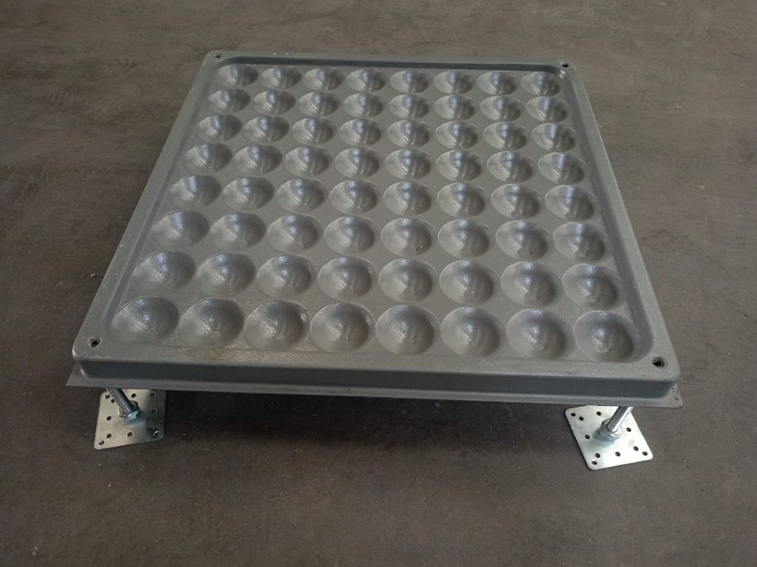 Raised Access Floor Panel with Adjustable Support Legs (Category: Construction & Building Materials) located in Paranaque City. Submitted by materesadimasaca (Listing ID 1470603651, Image 2). Description: - Heavy-duty metal raised floor tile with industrial grey powder-coated finish - Sturdy grid surface featurin multiple dimpled pockets for extra traction - Includes four adjustable threaded steel legs with bolted square mounting base plates - Cl